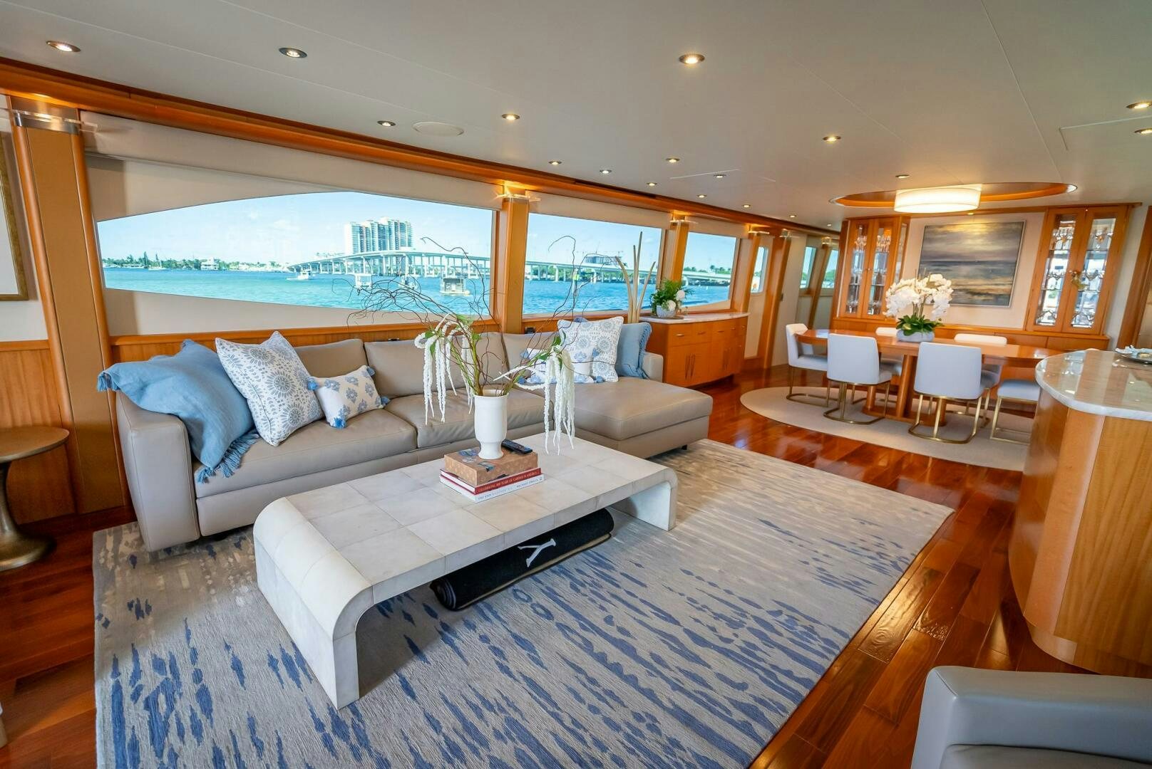 a living room with a large window aboard SERENITY Yacht for Sale