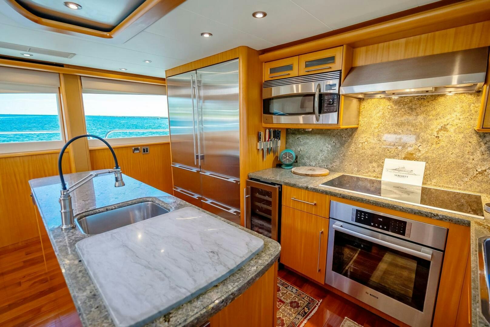 a kitchen with a large sink aboard SERENITY Yacht for Sale