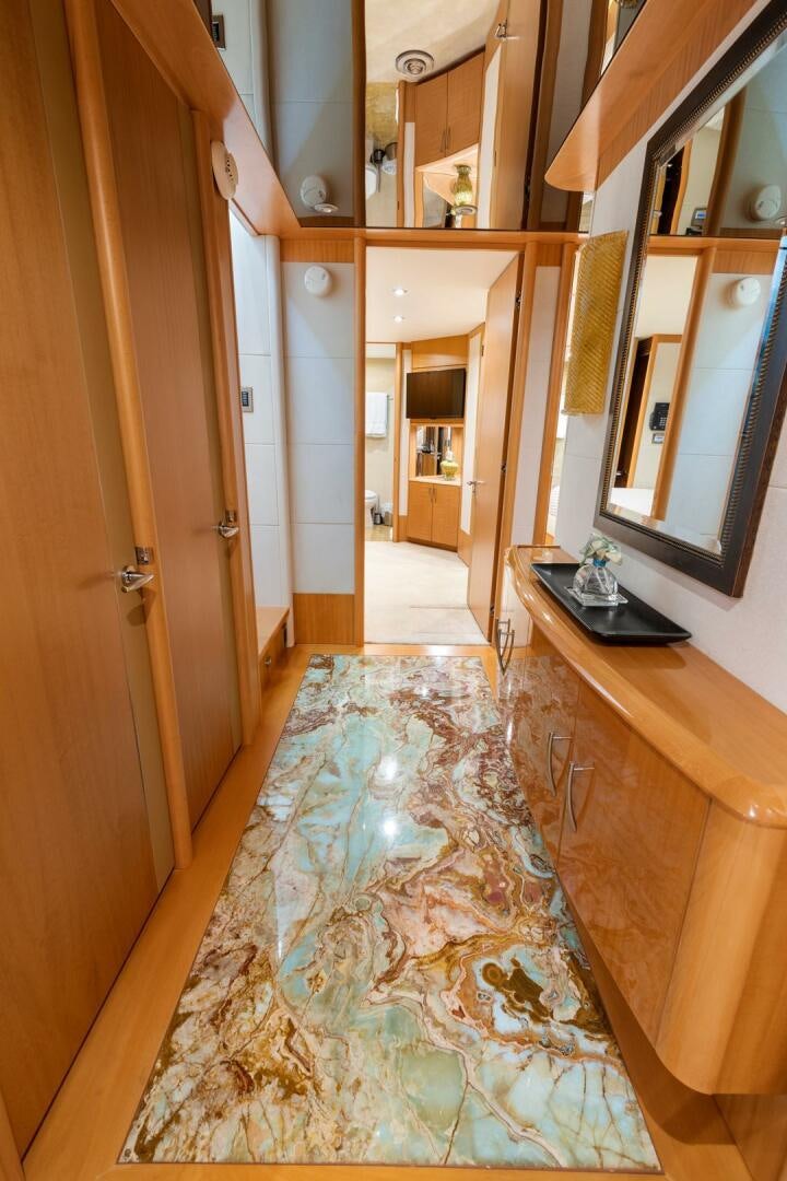 a bathroom with a countertop sink and mirror aboard SERENITY Yacht for Sale