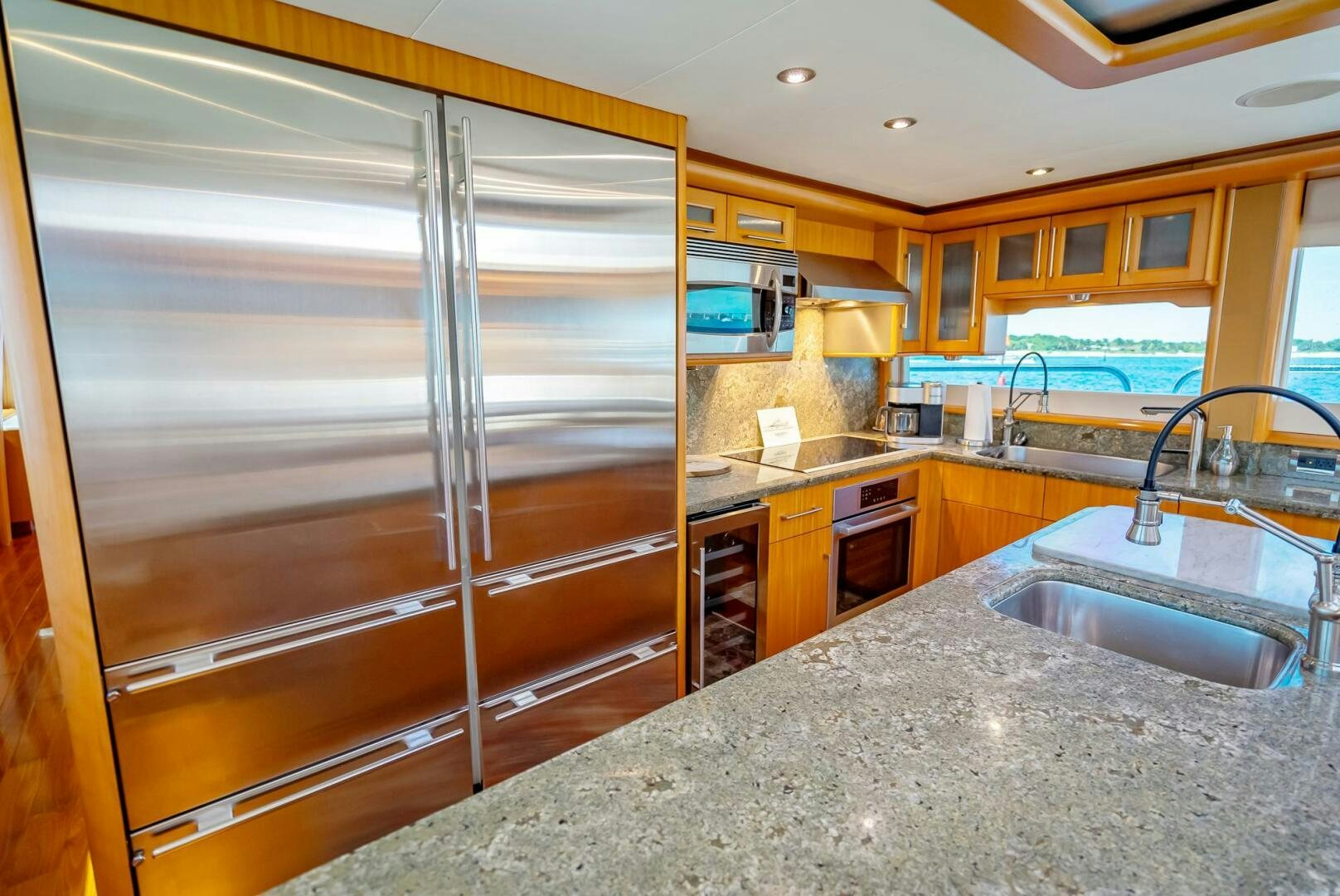 a kitchen with a stainless steel sink aboard SERENITY Yacht for Sale