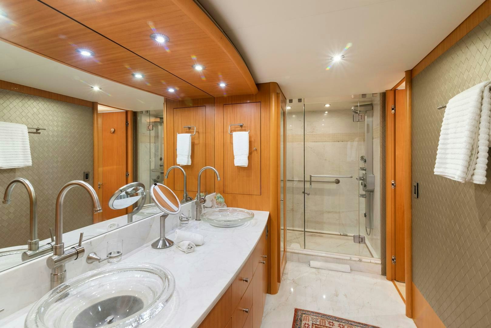 a bathroom with a large mirror aboard SERENITY Yacht for Sale