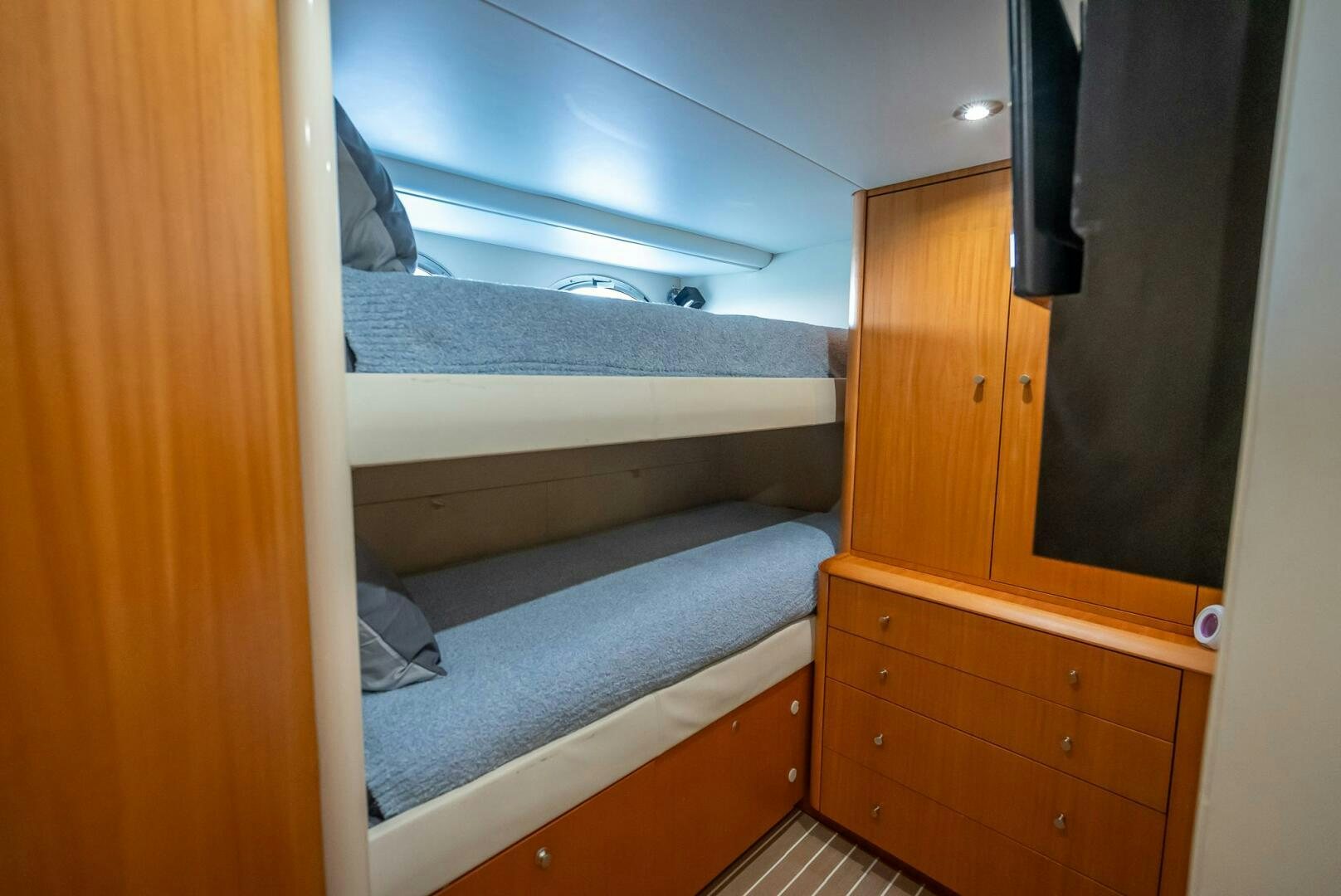 a room with bunk beds aboard SERENITY Yacht for Sale