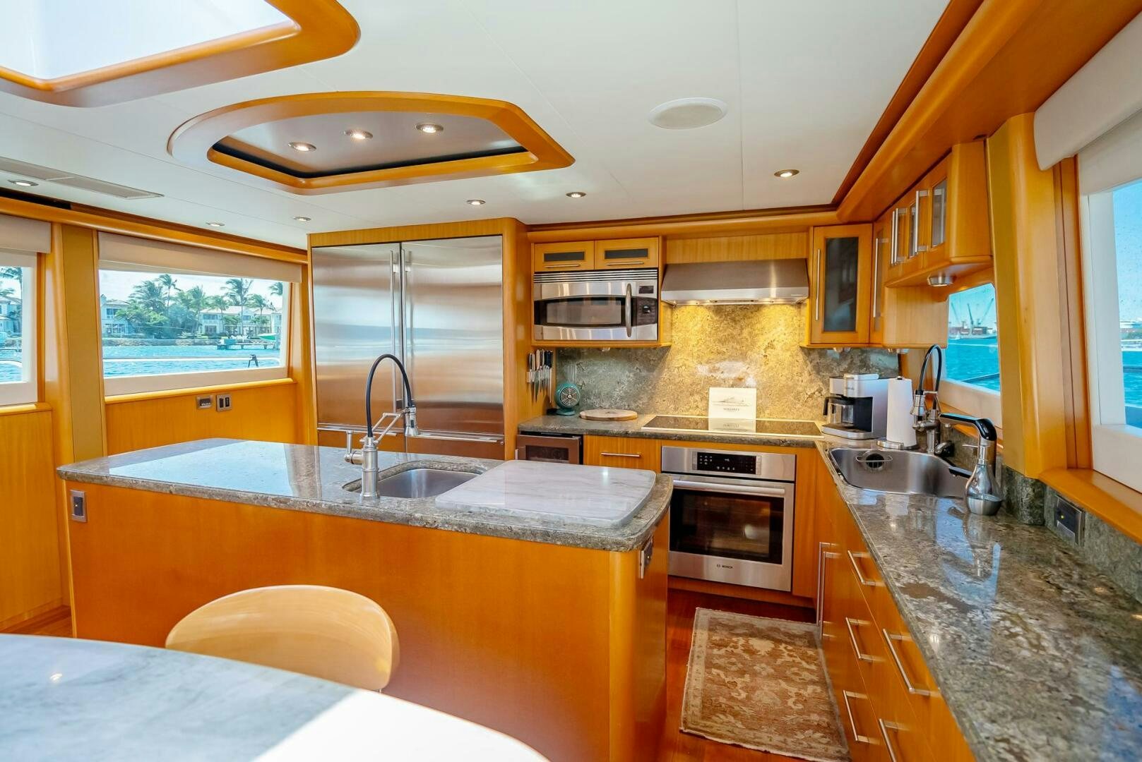 a kitchen with a large island aboard SERENITY Yacht for Sale