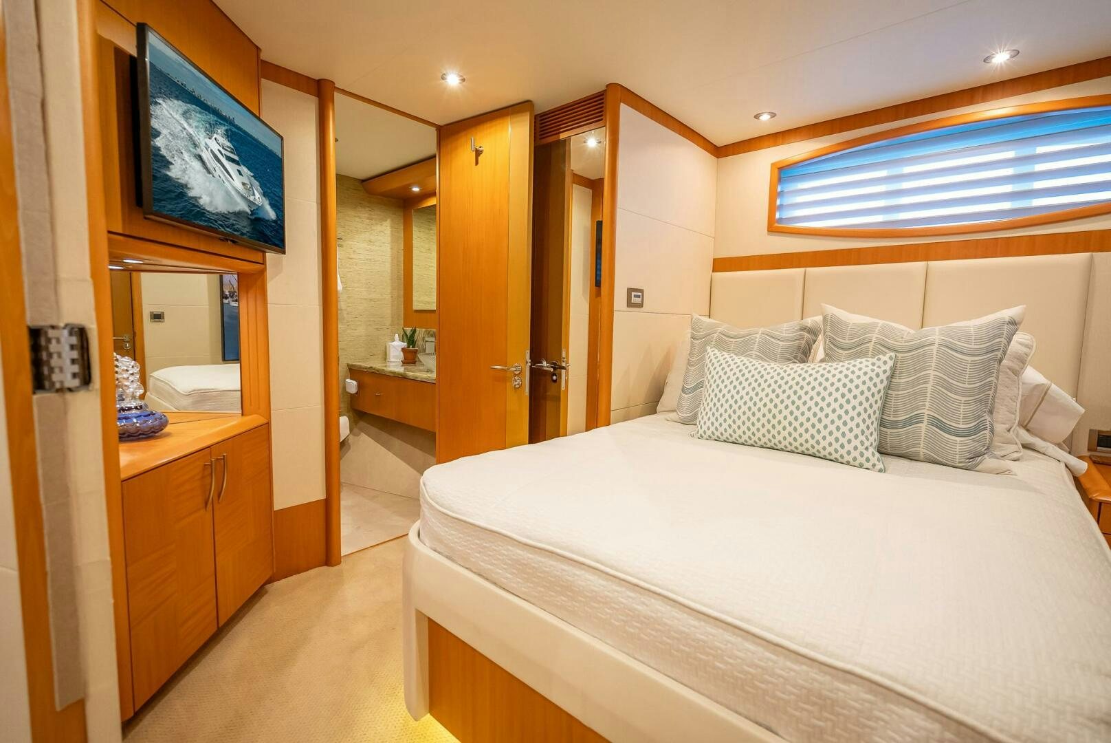 a hotel room with a bed aboard SERENITY Yacht for Sale