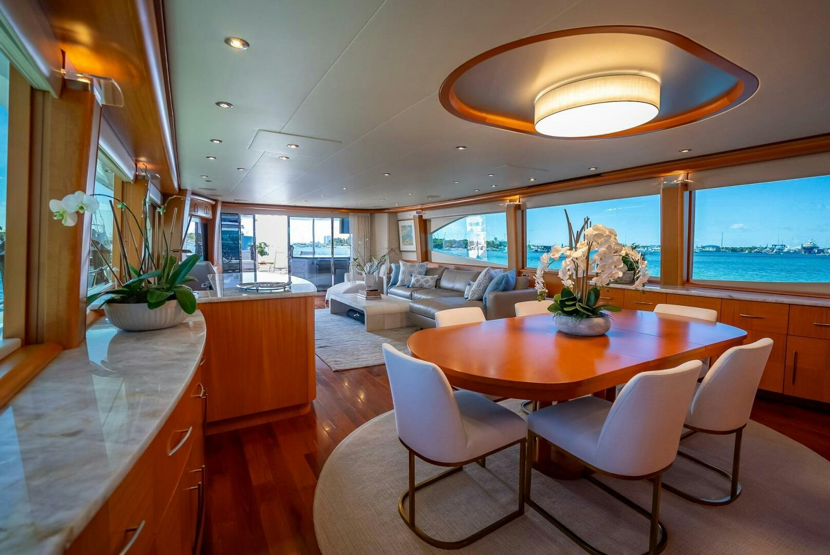 a large kitchen with a dining table aboard SERENITY Yacht for Sale