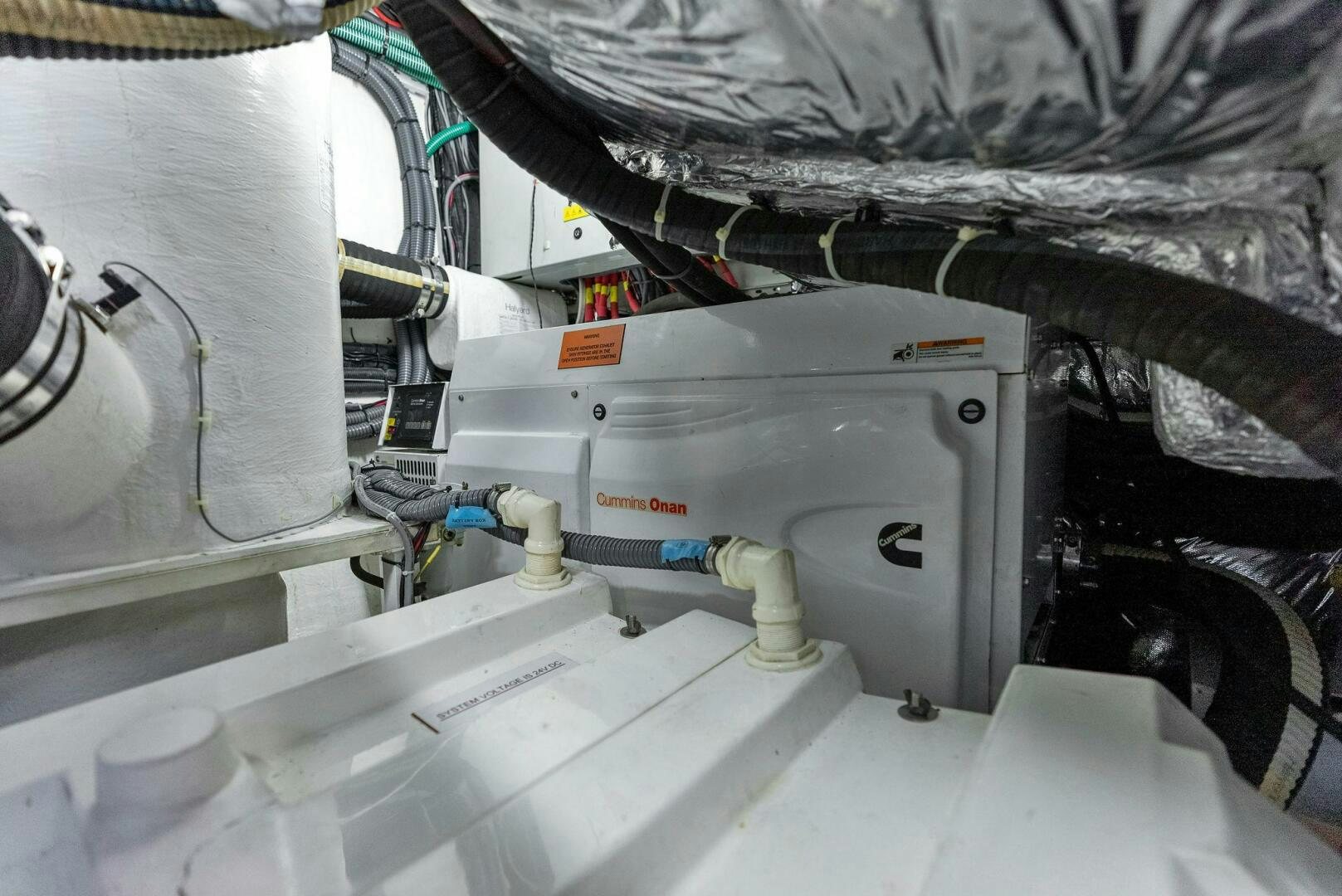 a white machine with a black cap aboard WOODY Yacht for Sale