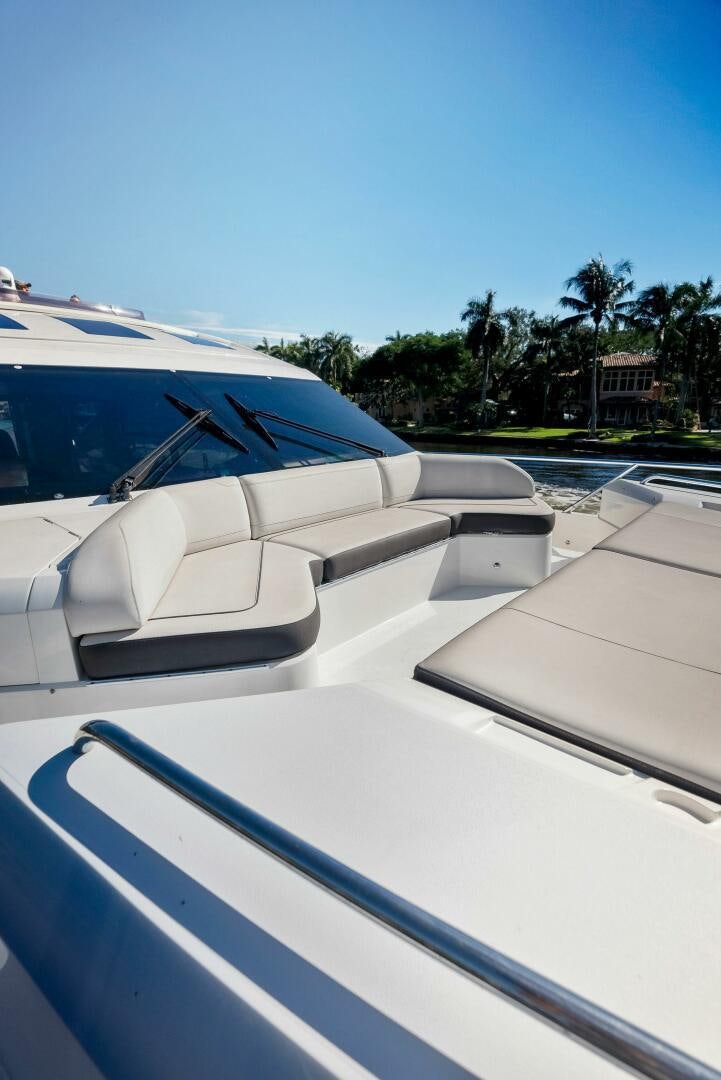 a white car parked on a road aboard WOODY Yacht for Sale