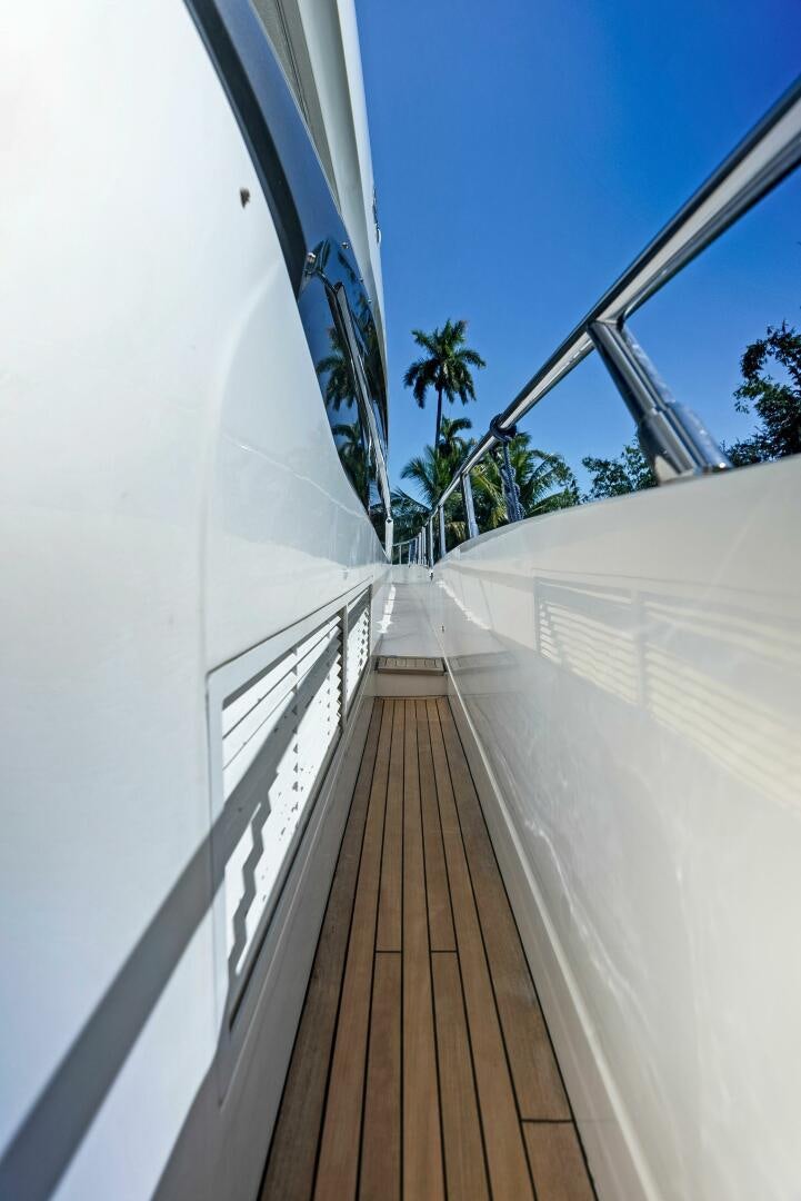 a long wooden walkway aboard WOODY Yacht for Sale