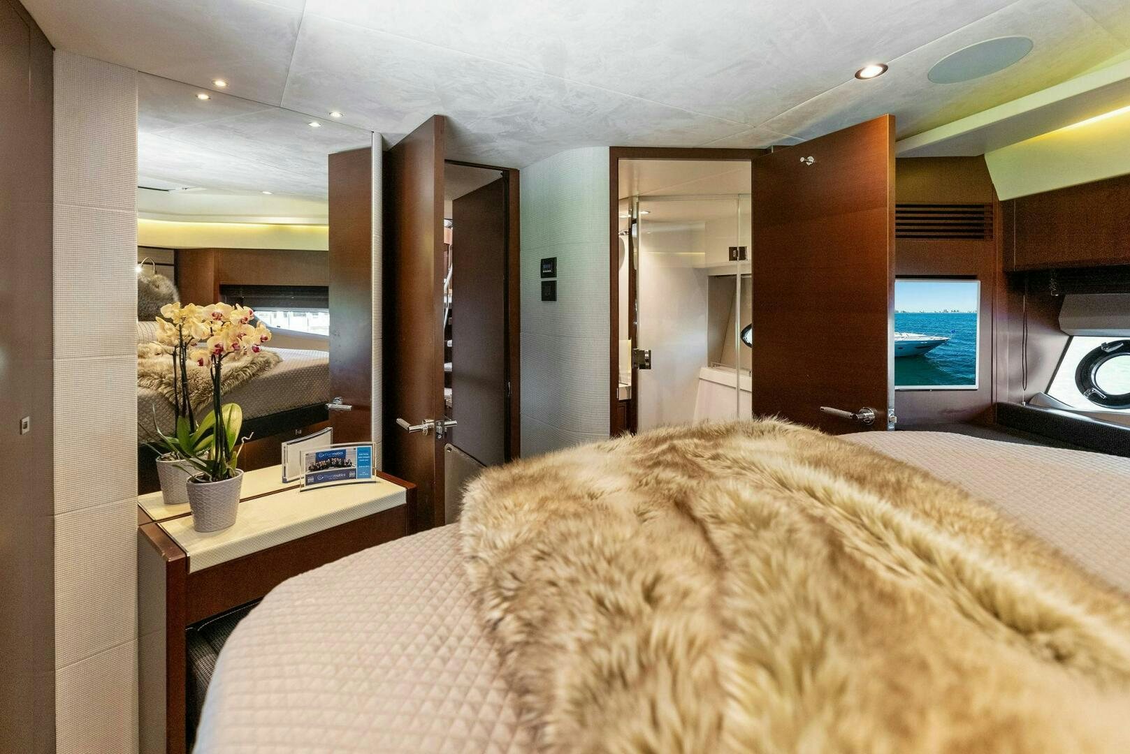 a bedroom with a large bed aboard WOODY Yacht for Sale