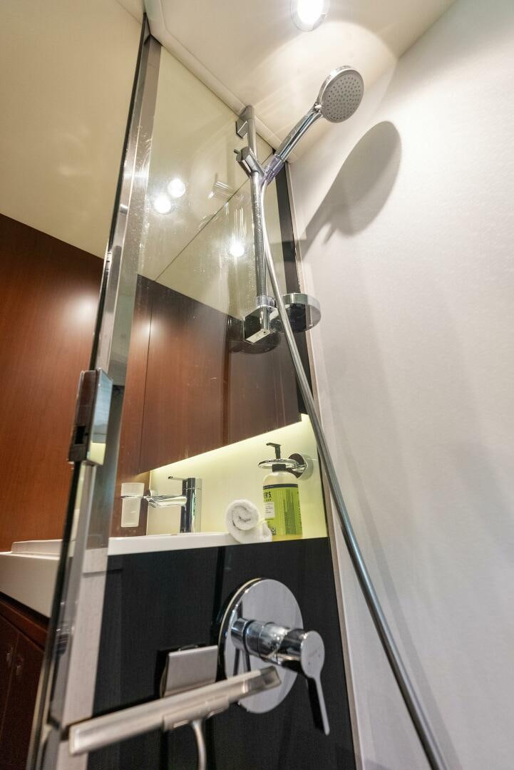 a shower head with a glass door aboard WOODY Yacht for Sale