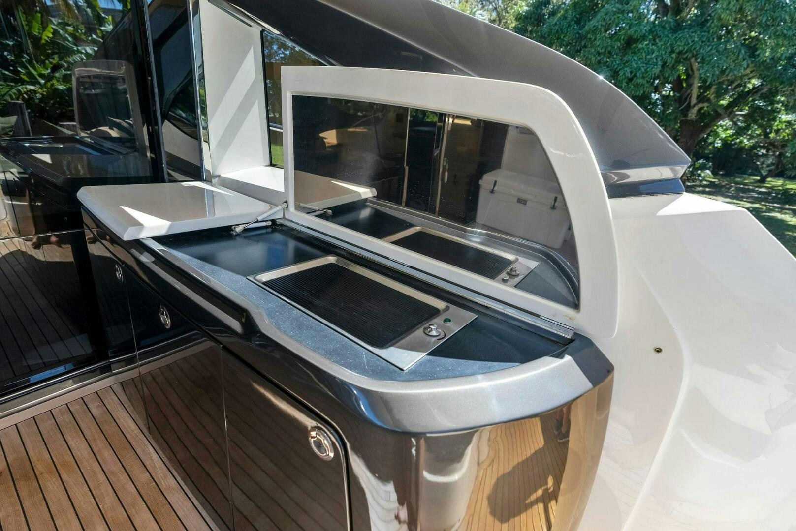 a car with a door open aboard WOODY Yacht for Sale