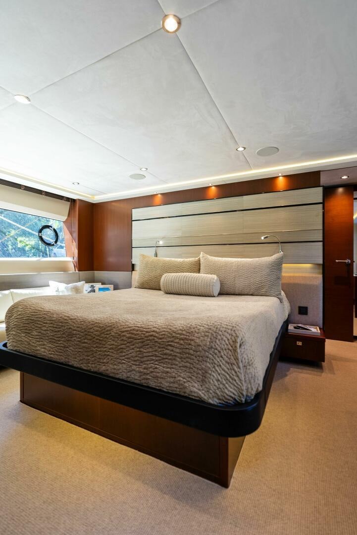 a bed in a room aboard WOODY Yacht for Sale