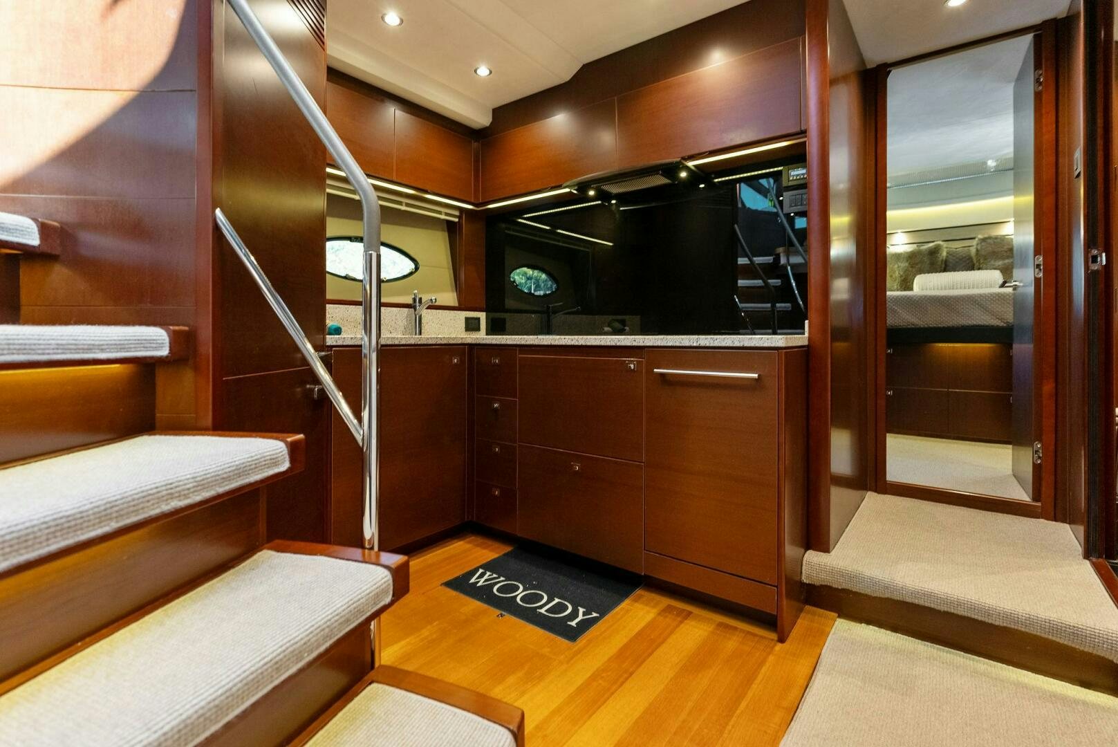 a room with a bed and a tv aboard WOODY Yacht for Sale