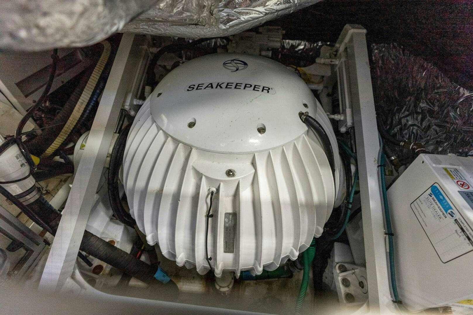 a white helmet on a table aboard WOODY Yacht for Sale