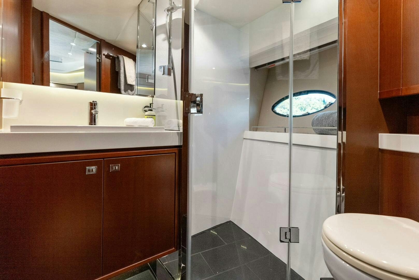 a bathroom with a shower and a sink aboard WOODY Yacht for Sale