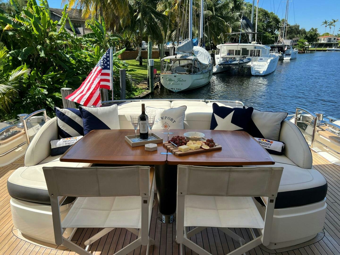 a table with food on it by a body of water aboard WOODY Yacht for Sale