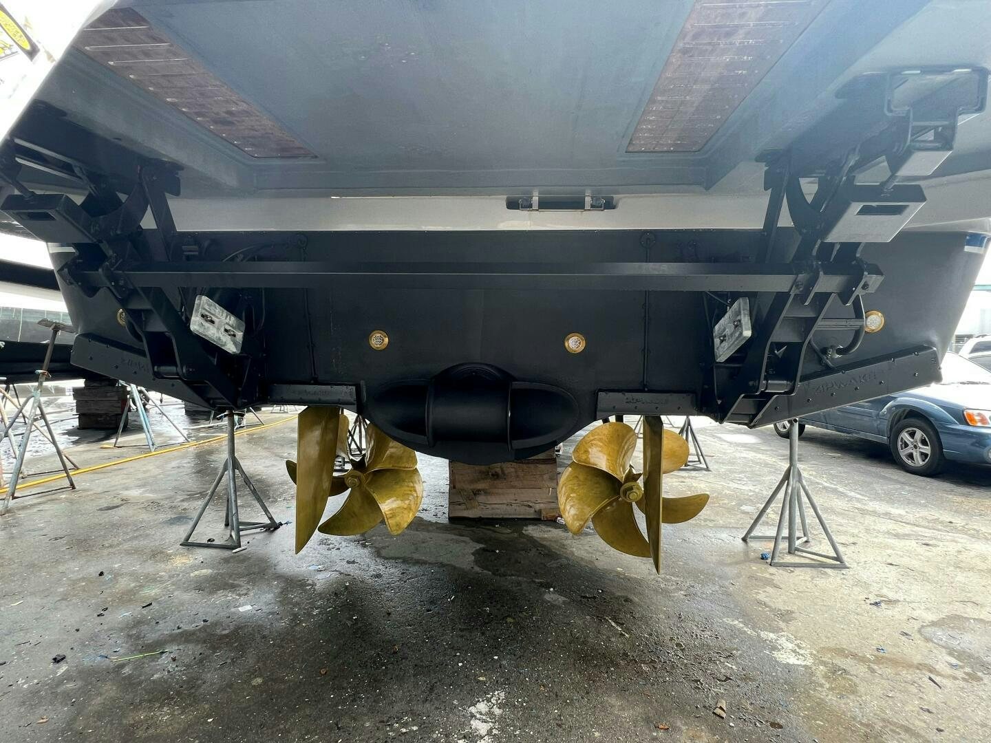 a large airplane with a large piece of equipment under it aboard WOODY Yacht for Sale