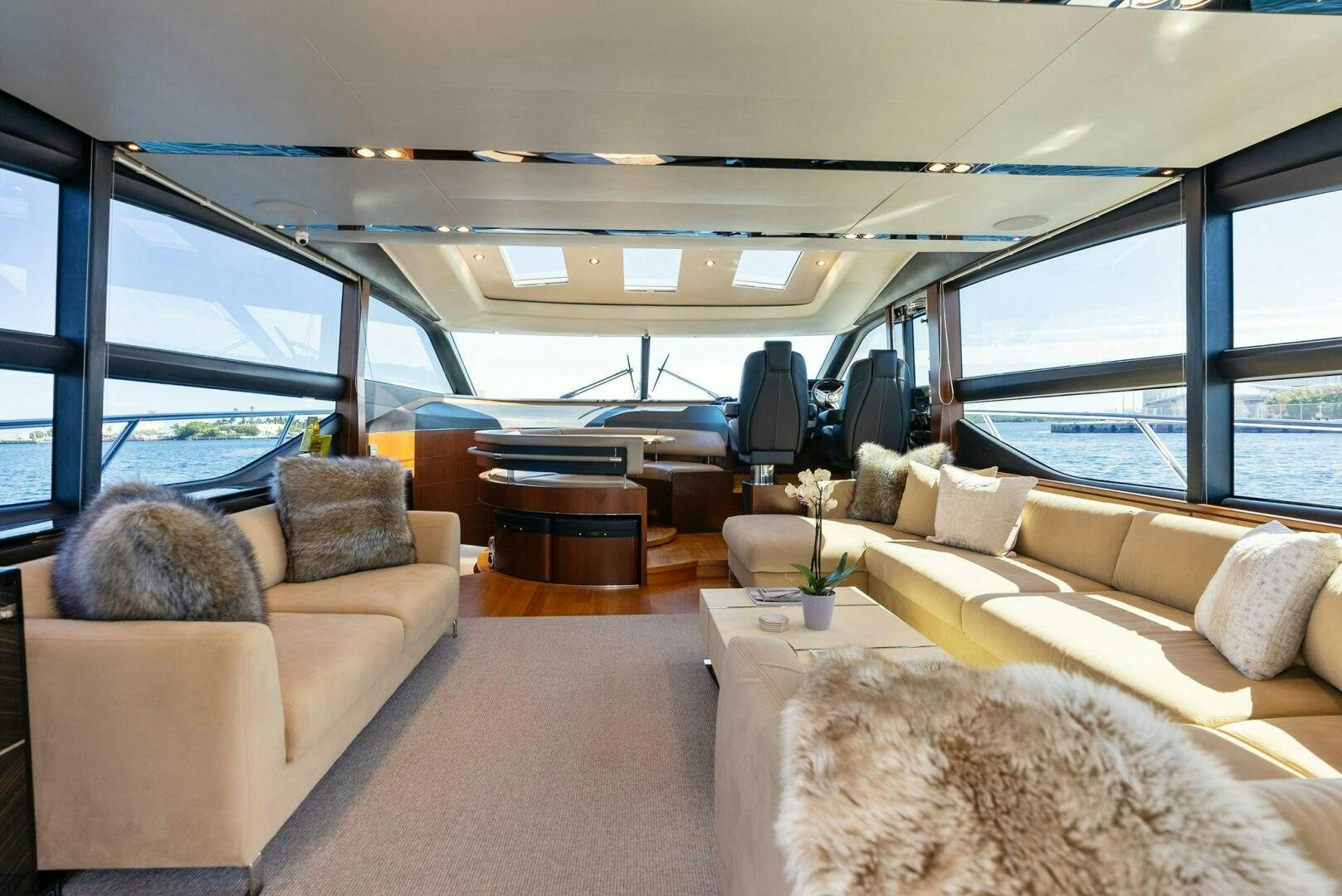 a living room with a couch and a table aboard WOODY Yacht for Sale