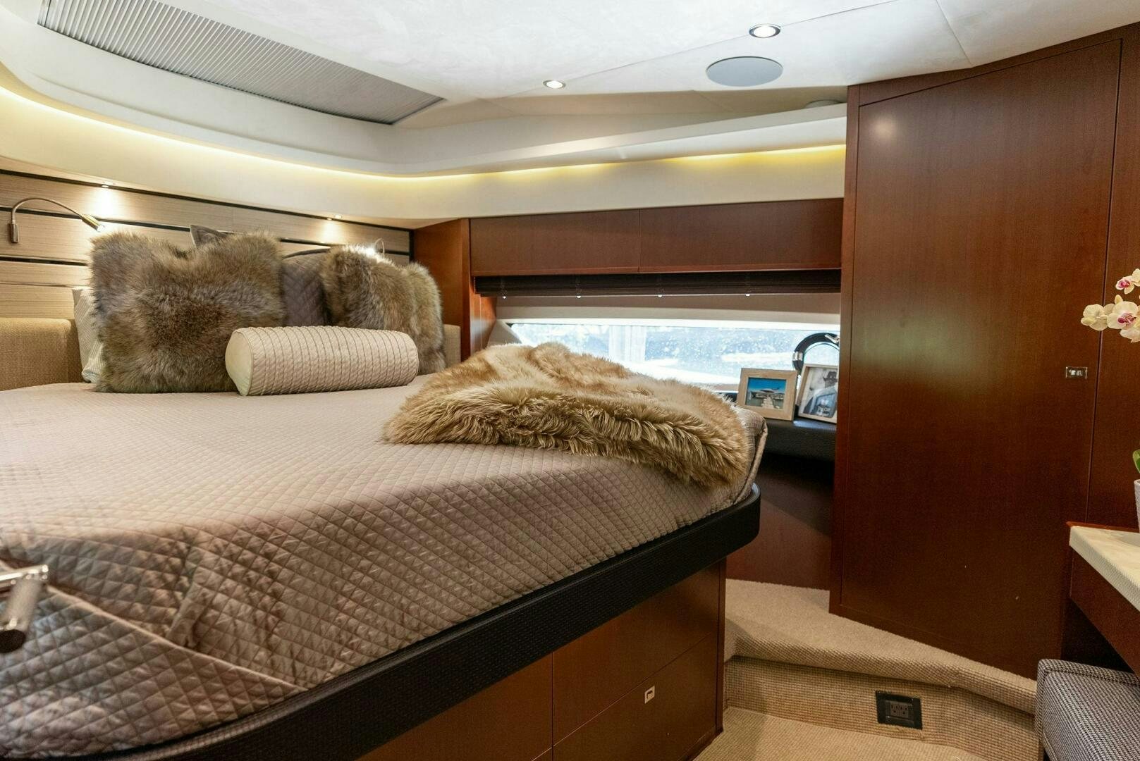 a bed with a mirror above it aboard WOODY Yacht for Sale