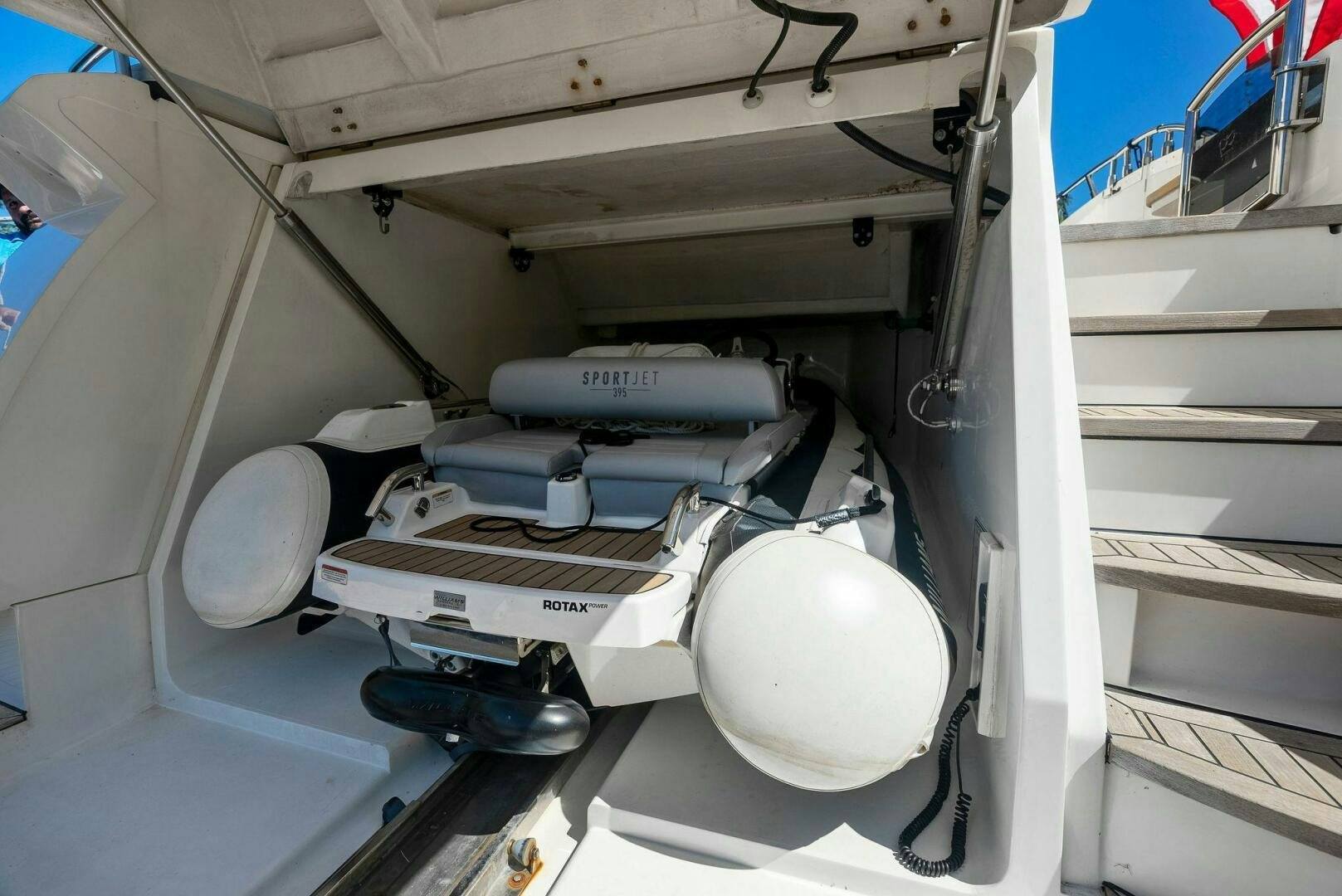 a white machine with a large white object on the side aboard WOODY Yacht for Sale