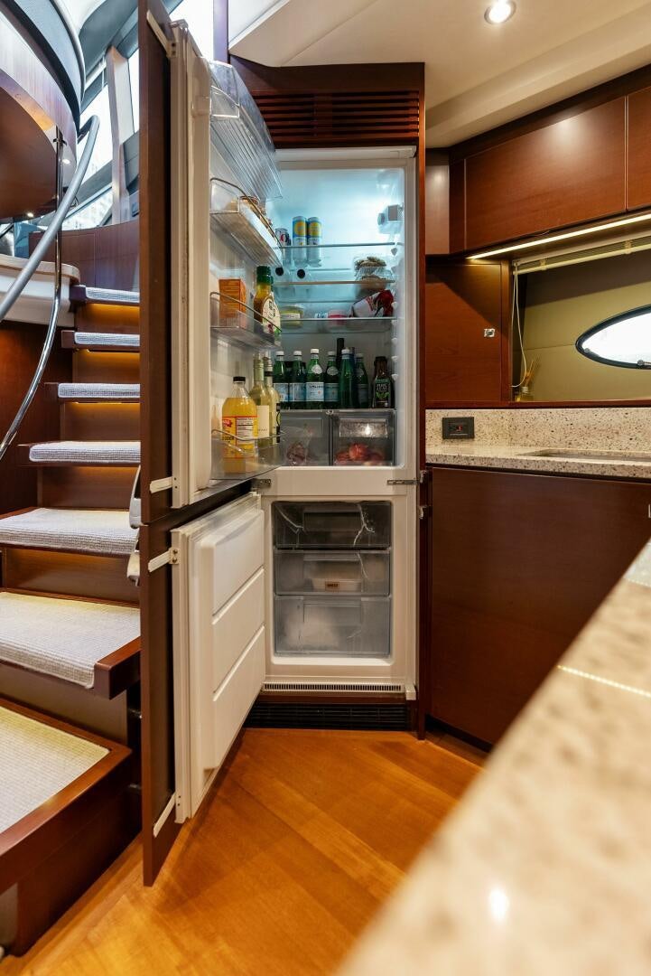 a fridge in a kitchen aboard WOODY Yacht for Sale