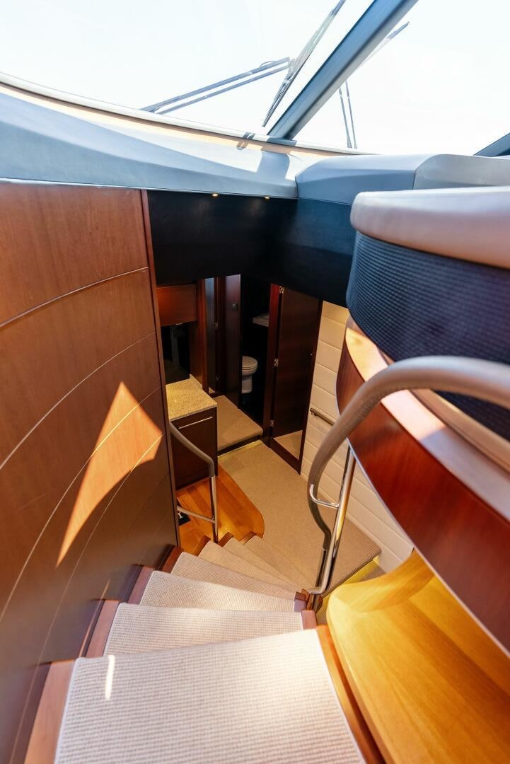 a room with a chair and a rug aboard WOODY Yacht for Sale