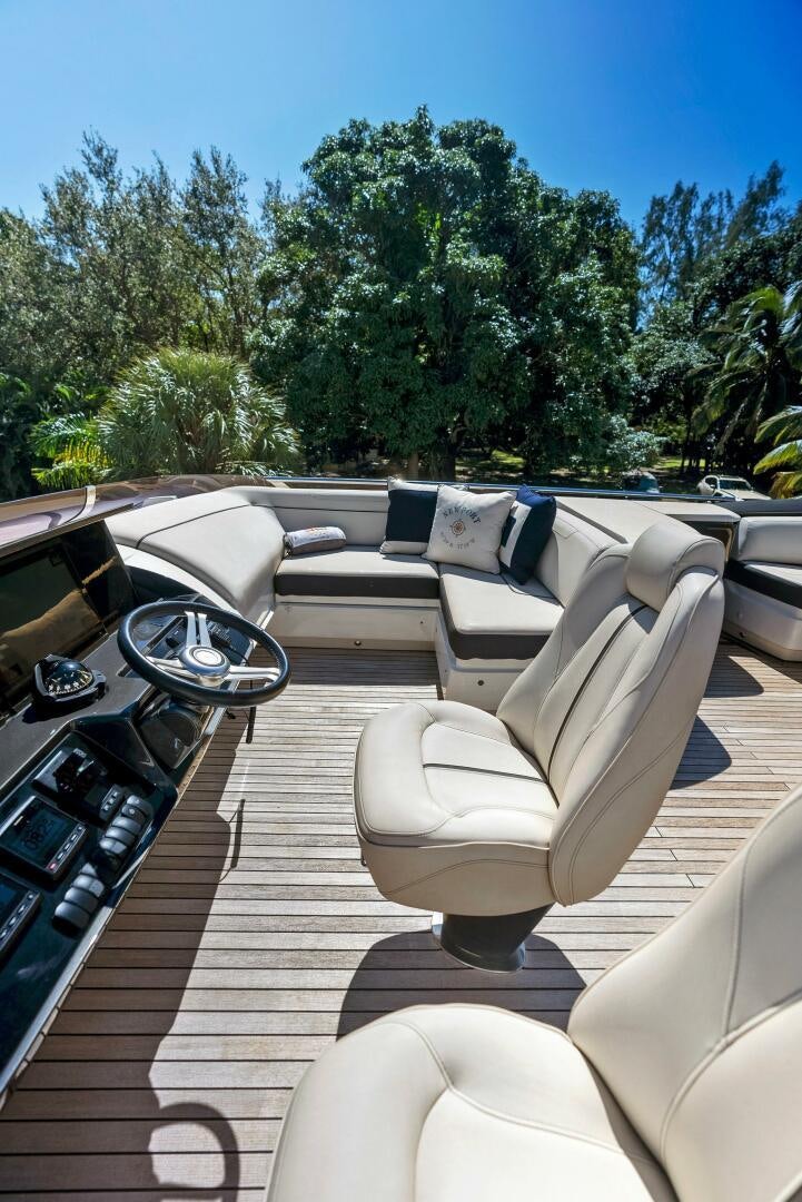 a car with seats and a seat aboard WOODY Yacht for Sale