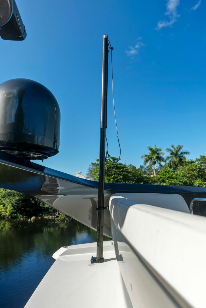a boat with a pole on the front aboard WOODY Yacht for Sale