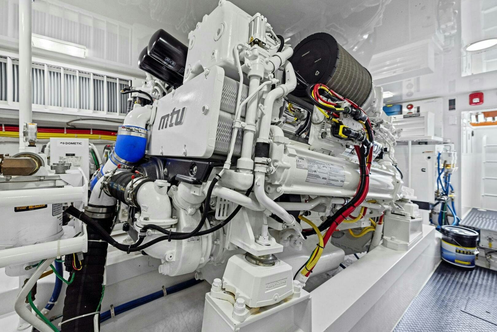 a white machine with blue and red lights aboard PLAN B Yacht for Sale