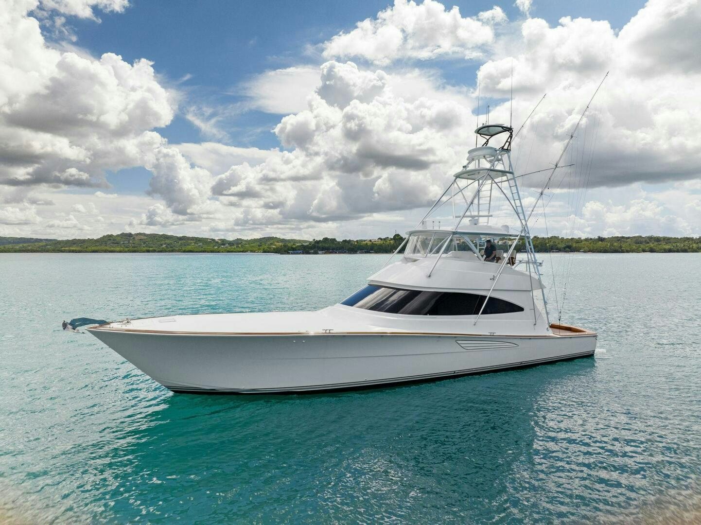 a white boat in the water aboard PLAN B Yacht for Sale
