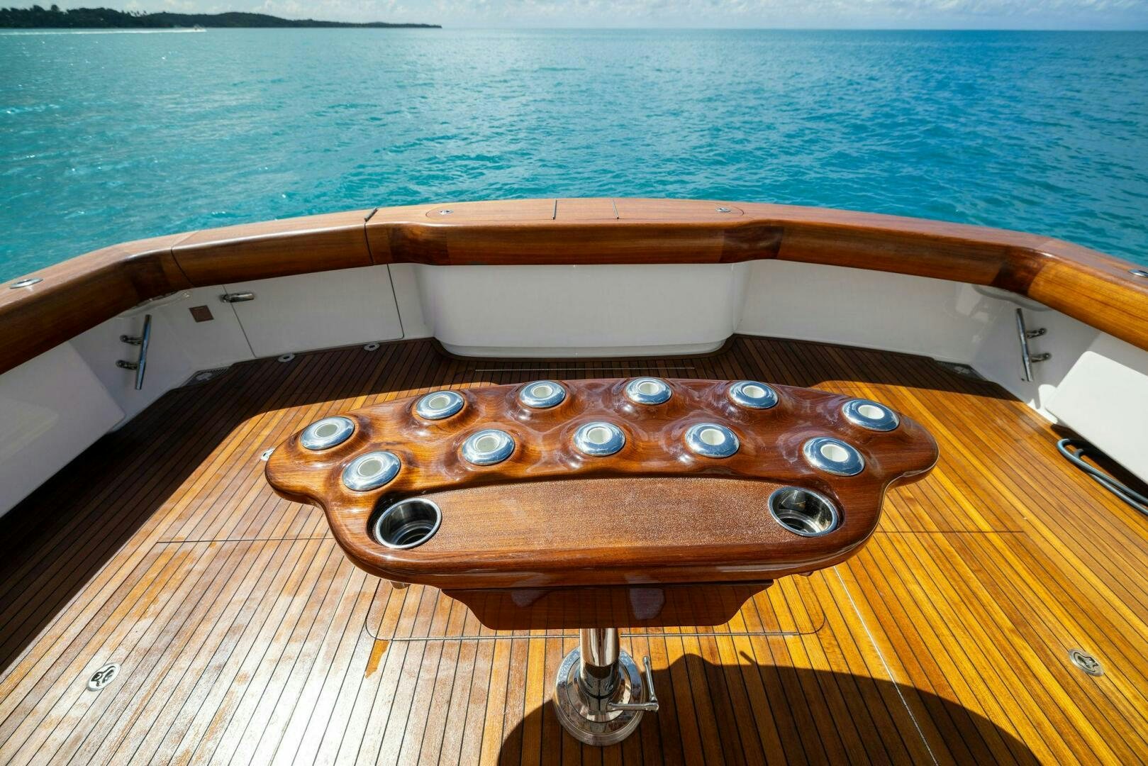 a wooden boat on a body of water aboard PLAN B Yacht for Sale