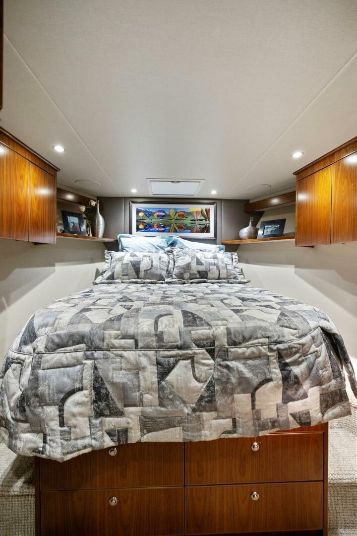 a bedroom with a bed aboard PLAN B Yacht for Sale