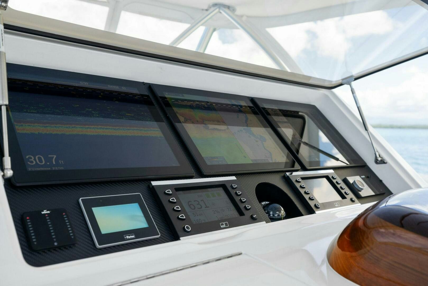 a car with a screen and buttons aboard PLAN B Yacht for Sale