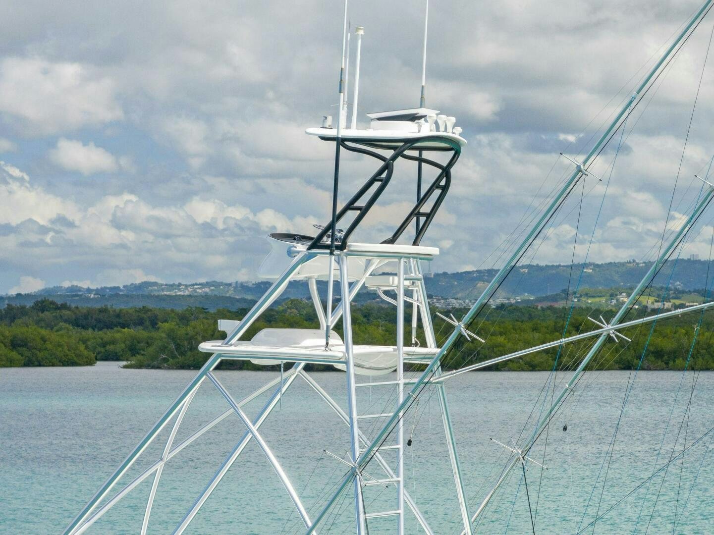 a white boat on water aboard PLAN B Yacht for Sale