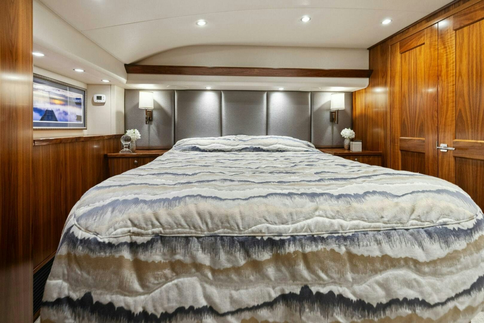 a large bed in a room aboard PLAN B Yacht for Sale