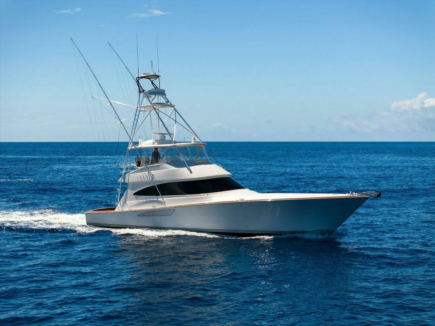 a white boat in the water aboard PLAN B Yacht for Sale