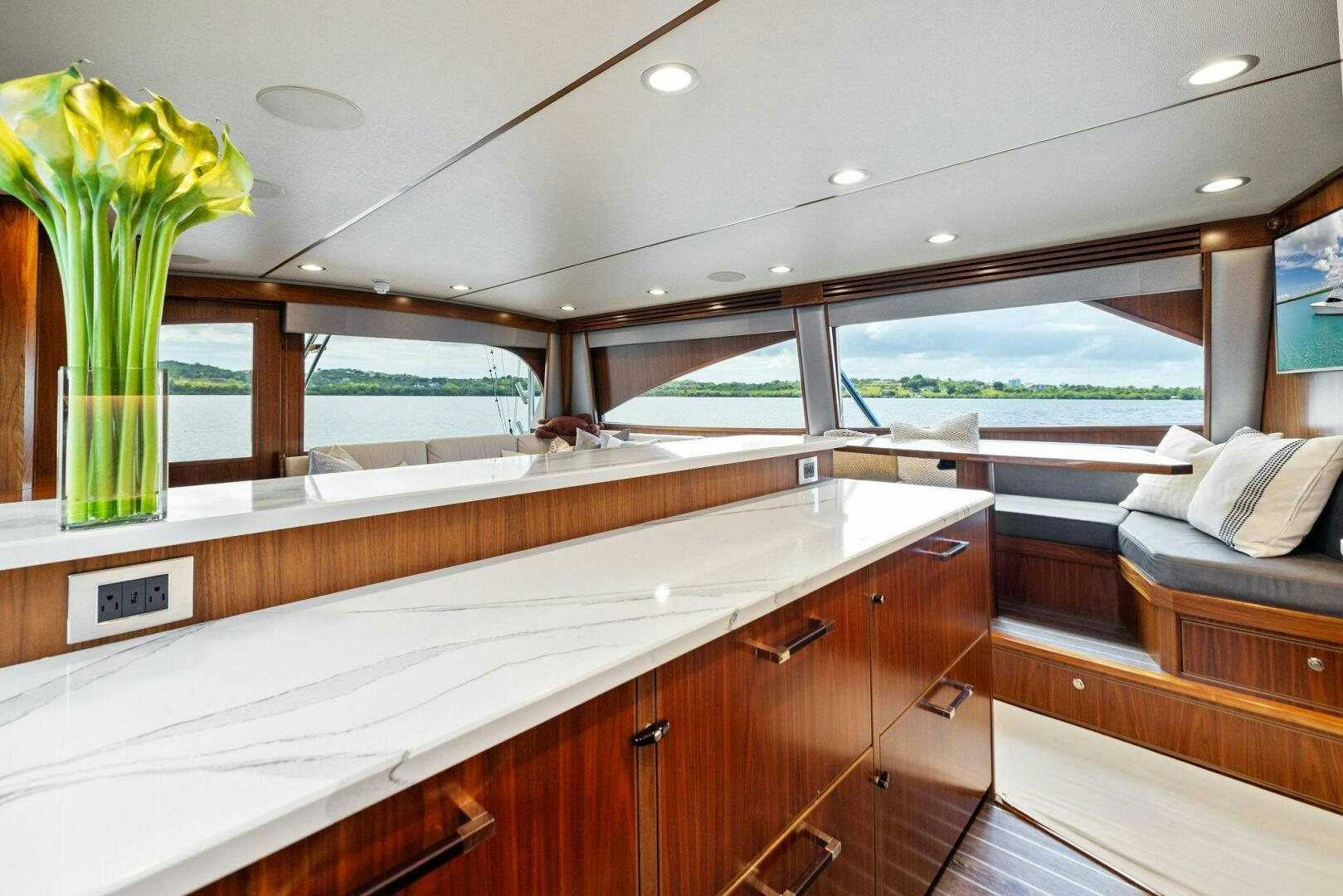 a room with a large window and a large pool aboard PLAN B Yacht for Sale