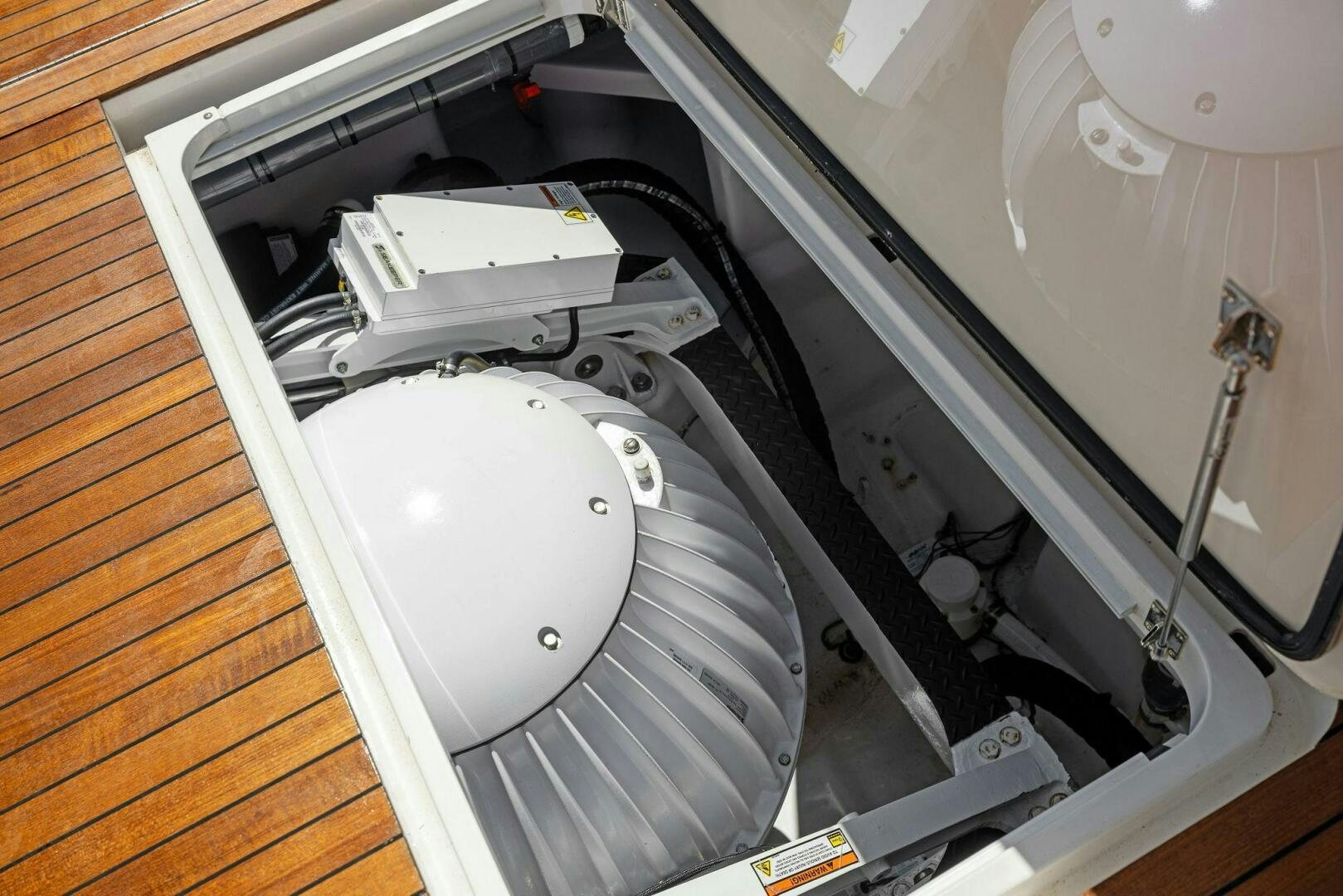 a white toilet with a white seat aboard PLAN B Yacht for Sale