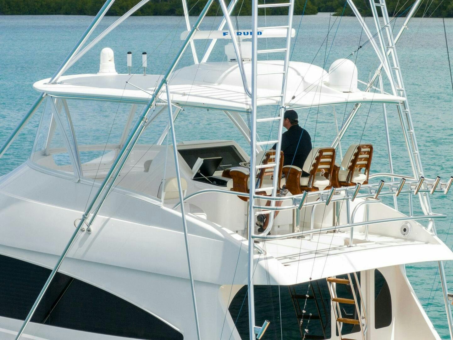 a person sitting on a boat aboard PLAN B Yacht for Sale