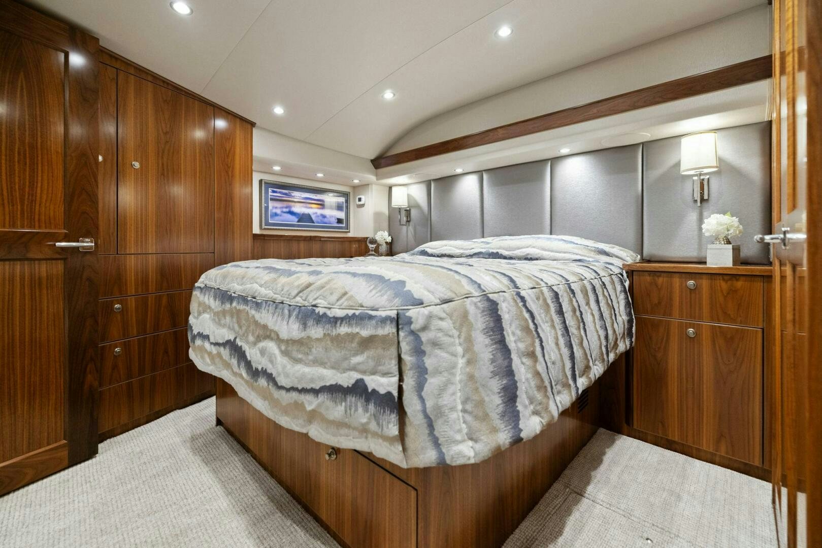 a bedroom with a bed and a television aboard PLAN B Yacht for Sale
