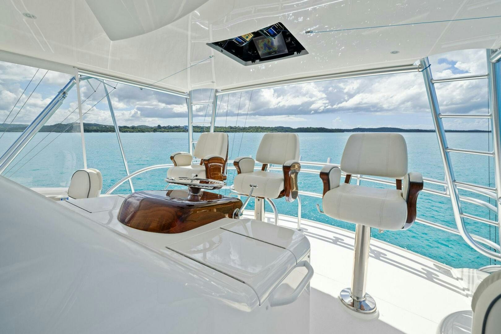 a room with a table chairs and a large window aboard PLAN B Yacht for Sale