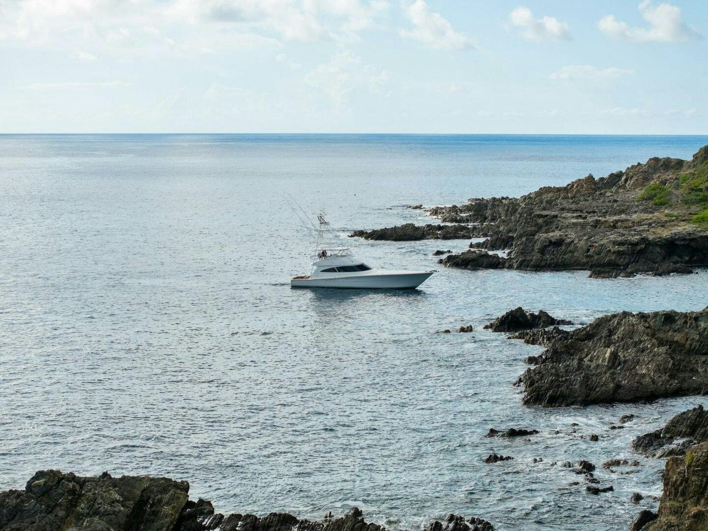 a boat sailing in the sea aboard PLAN B Yacht for Sale