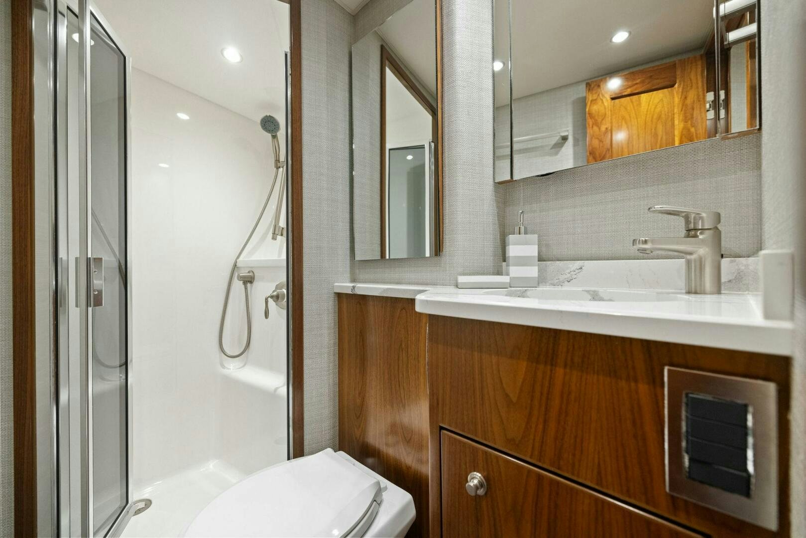 a bathroom with a sink and a toilet aboard PLAN B Yacht for Sale