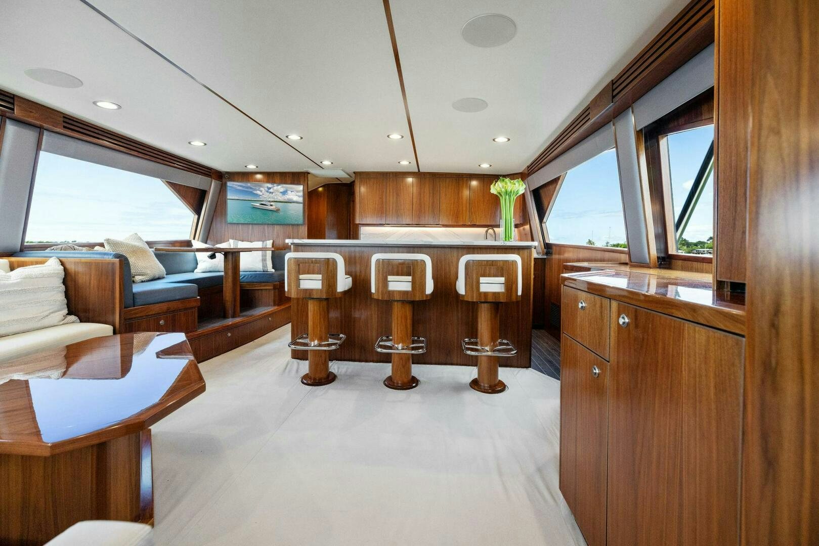 a room with a couch and a table aboard PLAN B Yacht for Sale