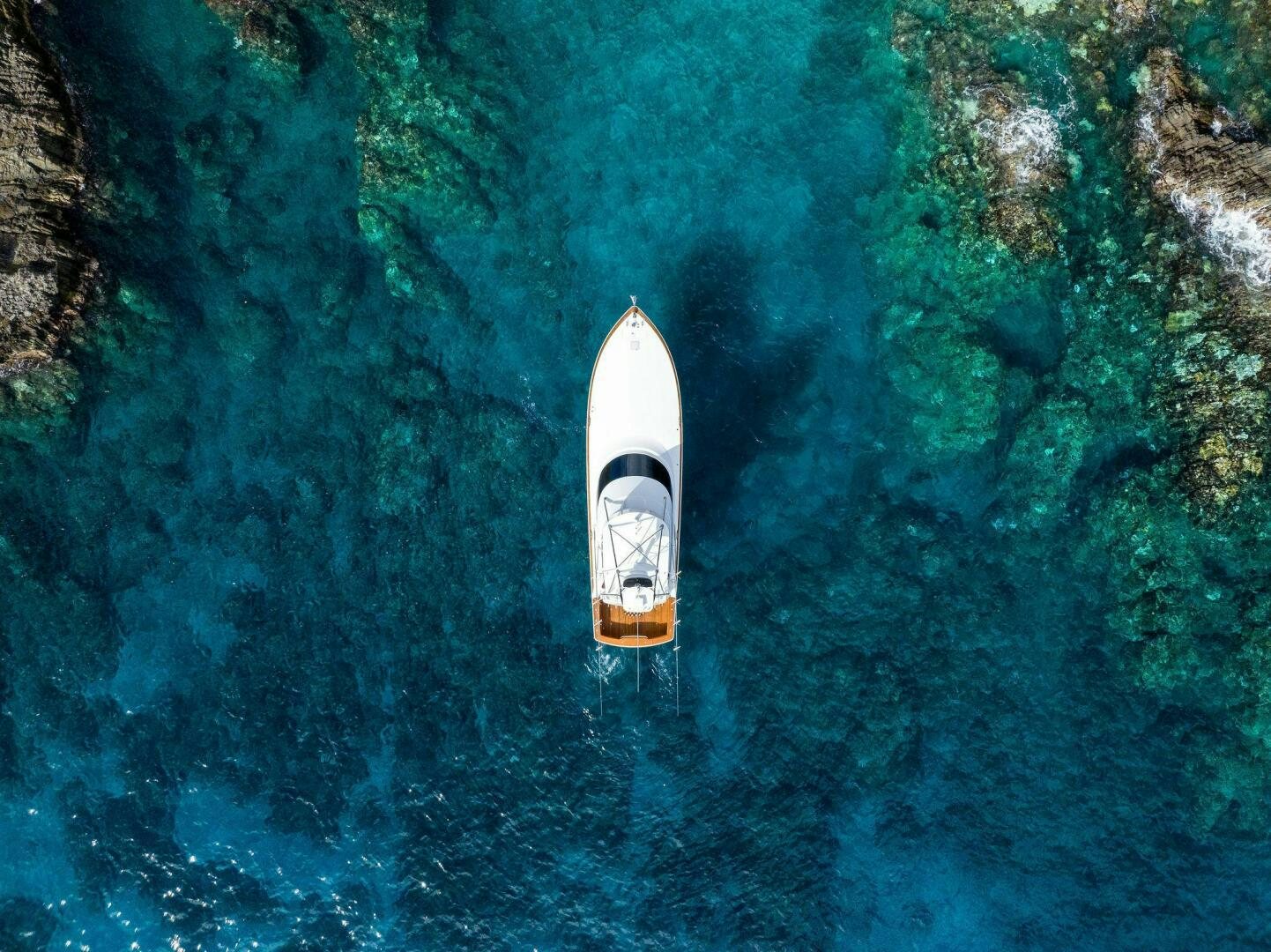 a boat in the water aboard PLAN B Yacht for Sale