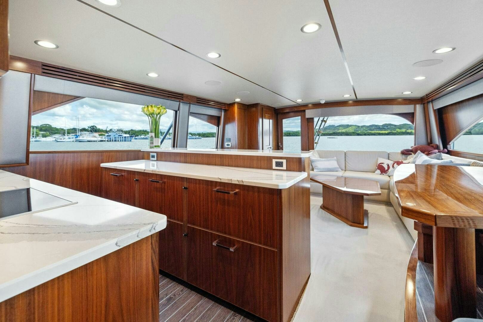 a kitchen with wooden cabinets aboard PLAN B Yacht for Sale