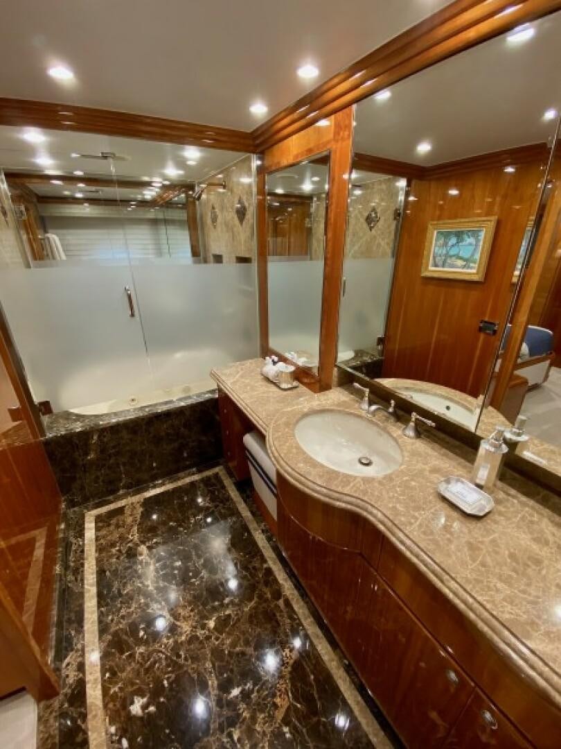 a bathroom with a large mirror aboard BRANDI WINE Yacht for Sale