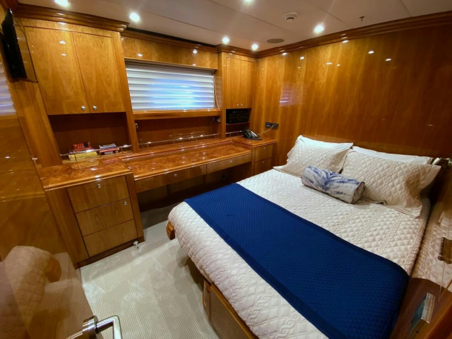 a room with a bed and a desk aboard BRANDI WINE Yacht for Sale