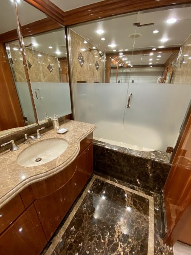 a bathroom with a marble counter top aboard BRANDI WINE Yacht for Sale