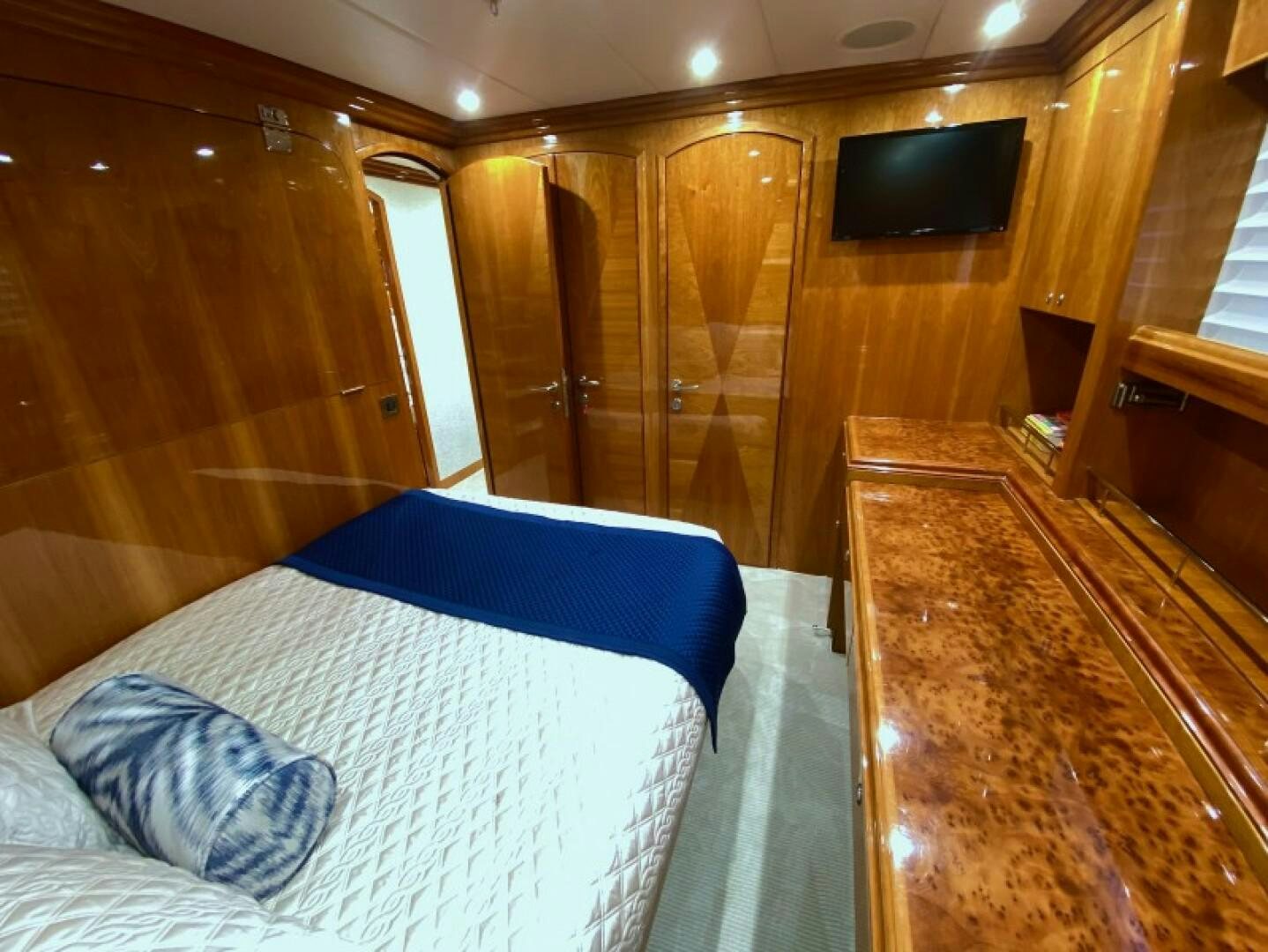 a cabin with a bed and a television aboard BRANDI WINE Yacht for Sale
